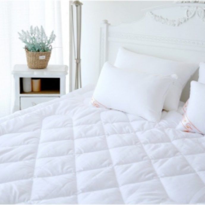 White quilted bed throw